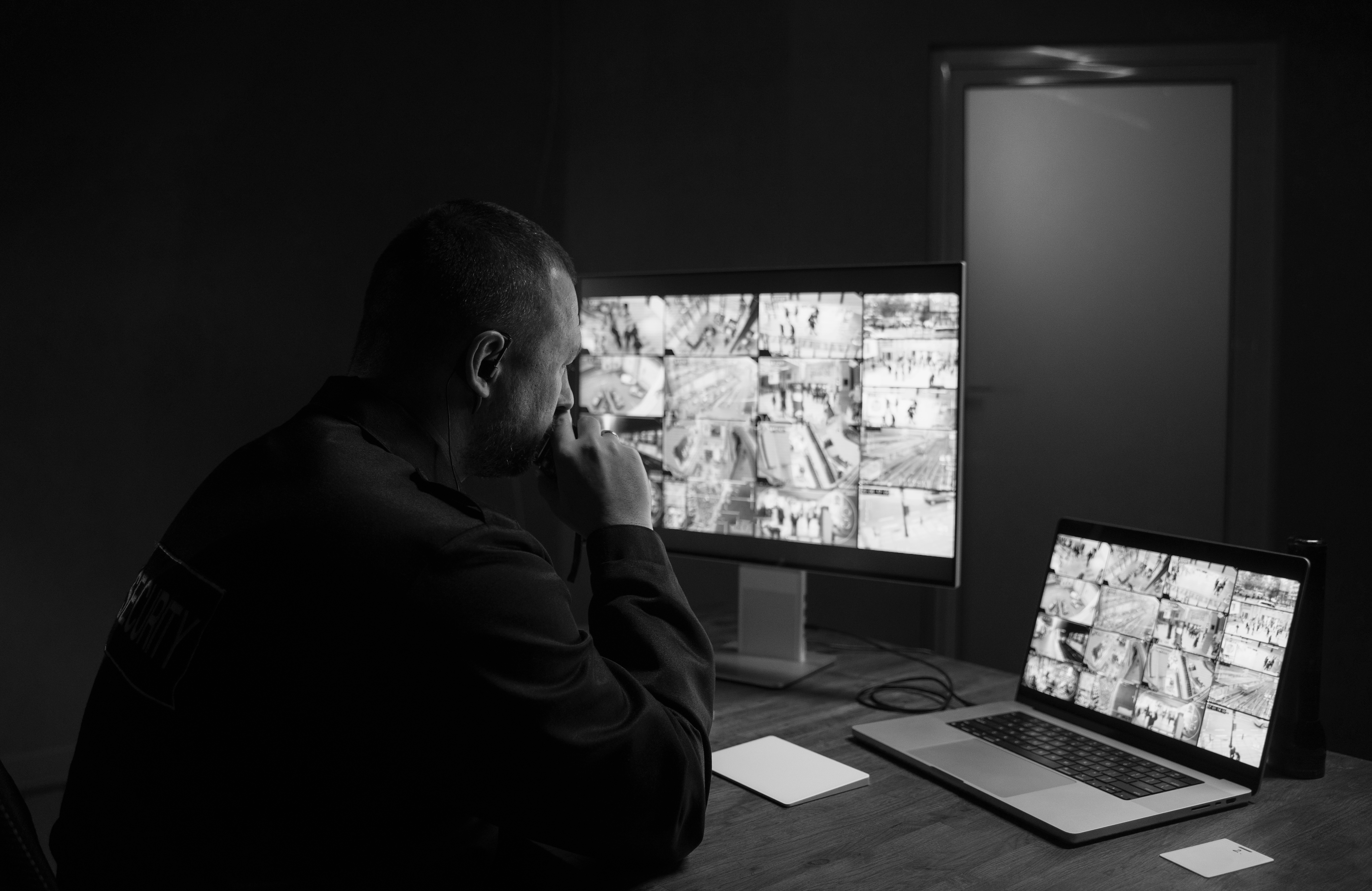Man looking at the screen with multiple images